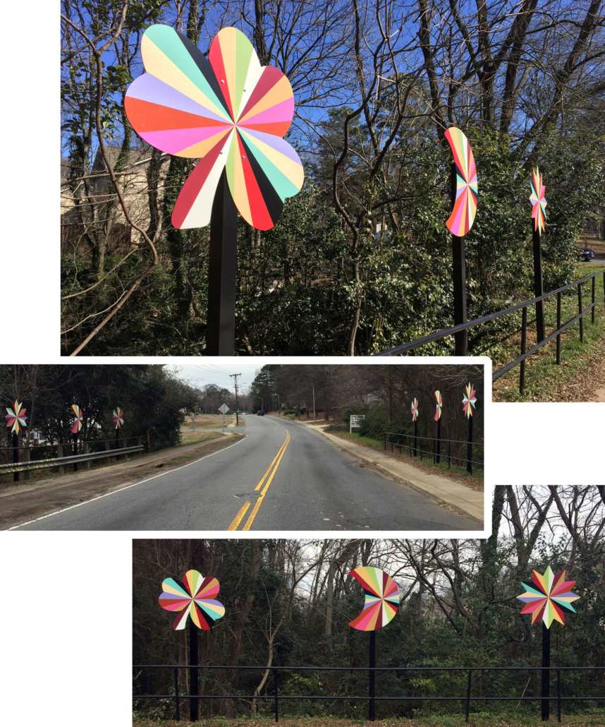 Six 4’ x 4’ x 10’ aluminum pinwheels in a kaleidoscope of colors flank the two lane road of the Plaza Shamrock Neighborhood bridge in Charlotte, NC.