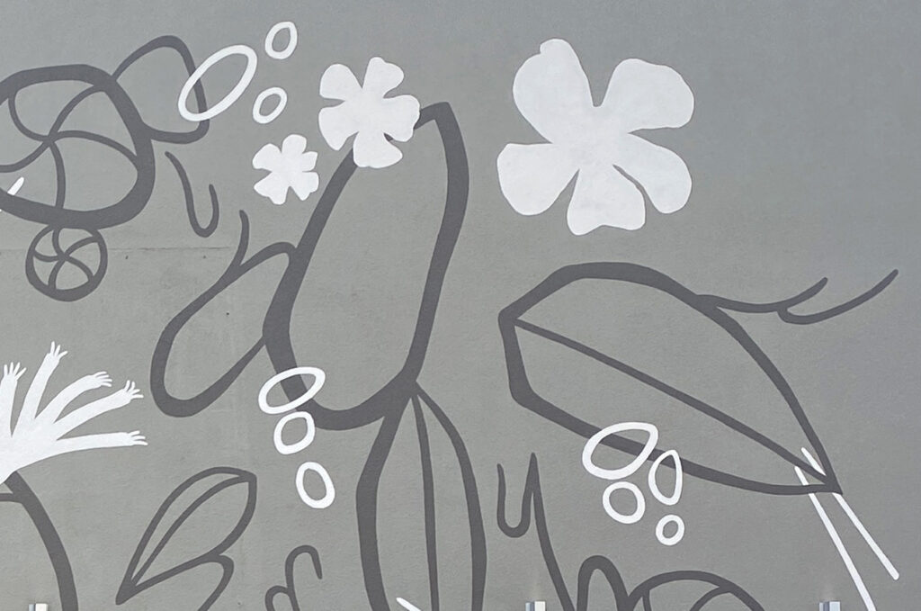 This Fairfield Marriott Uptown Charlotte mural showcases native flora, creating a warm, welcoming garage entrance for guests, visitors, and staff alike.